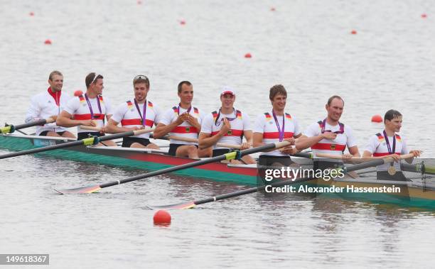 The Germany team celebrate with their medals after winning gold in the Men's Eight Final on Day 5 of the London 2012 Olympic Games at Eton Dorney on...