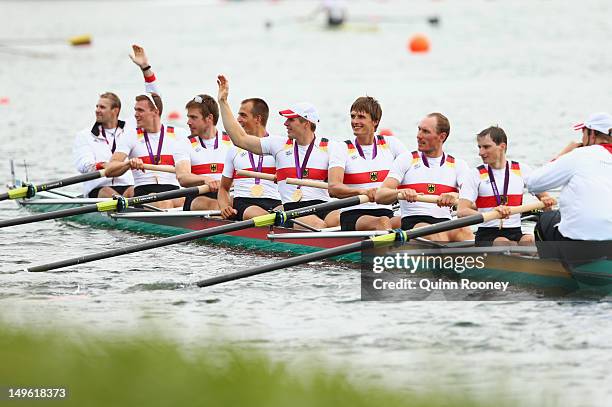 The Germany team celebrate in their boat with their medals after winning gold in the Men's Eight Final on Day 5 of the London 2012 Olympic Games at...