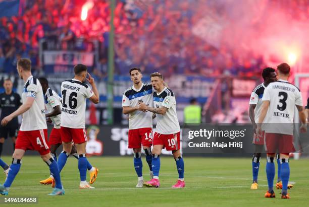 Sonny Kittel of Hamburger SV celebrates with teammate Ludovit Reis after scoring the team's first goal during the Bundesliga playoffs second leg...