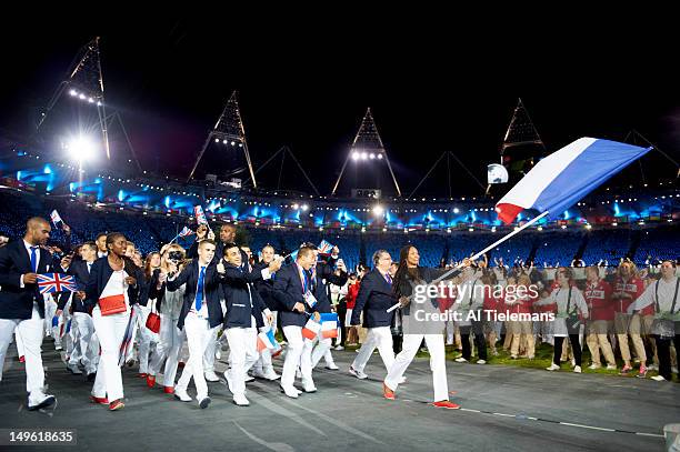 Summer Olympics: Team France fencing athlete and national flag bearer Laura Flessel-Colovic during Parade of Nations at Olympic Stadium. London,...