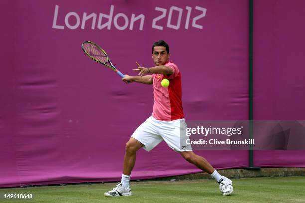 Nicolas Almagro of Spain returns a shot to Steve Darcis of Belgium during the third round of Men's Singles Tennis on Day 5 of the London 2012 Olympic...