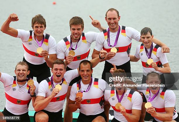 The Germany team members celebrate with their medals after winning gold in the Men's Eight Final on Day 5 of the London 2012 Olympic Games at Eton...