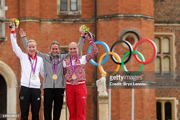 Silver medallist Judith Arndt of Germany, gold medallist Kristin Armstrong of the United States, and bronze medallist Olga Zabelinskaya of Russia...