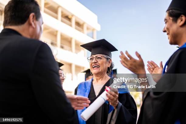 Graduation Received 2,640 Graduation Ceremony And Receiving Diploma Stock Photos, High-Res ...