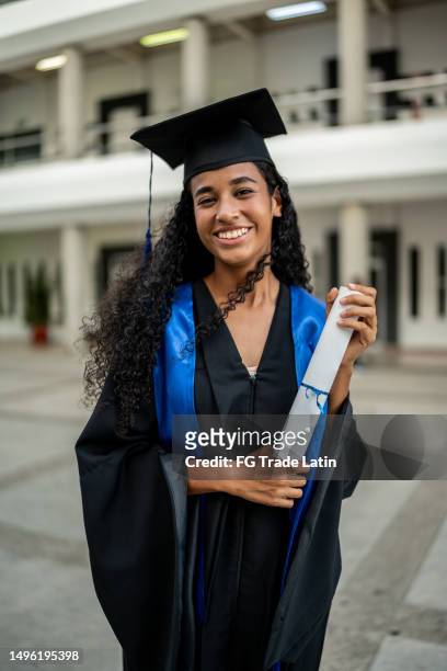 portrait of young graduate woman on her graduation - scholarship award stock pictures, royalty-free photos & images
