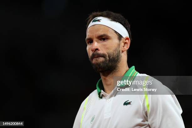 Grigor Dimitrov of Bulgaria reacts against Alexander Zverev of Germany during the Men's Singles Fourth Round match on Day Nine of the 2023 French...