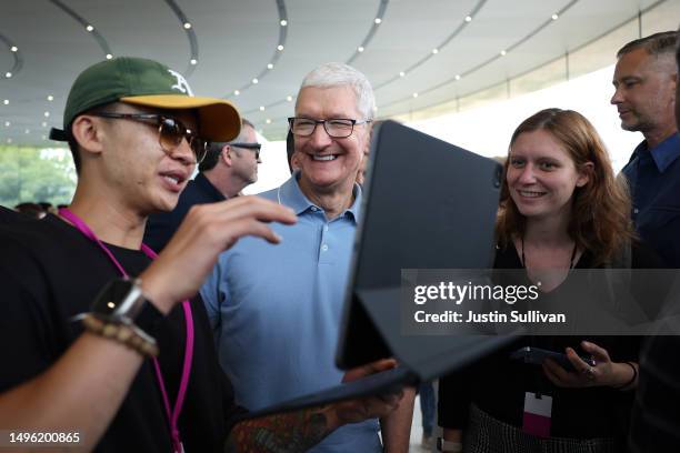 Apple CEO Tim Cook greets attendees during the Apple Worldwide Developers Conference on June 05, 2023 in Cupertino, California. Apple CEO Tim Cook...