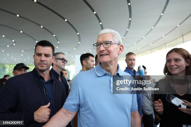 Apple CEO Tim Cook greets attendees during the Apple Worldwide Developers Conference on June 05, 2023 in Cupertino, California. Apple CEO Tim Cook...