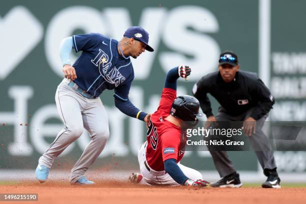 Alex Verdugo of the Boston Red Sox is tagged out by Wander Franco of the Tampa Bay Rays during the eighth inning at Fenway Park on June 05, 2023 in...