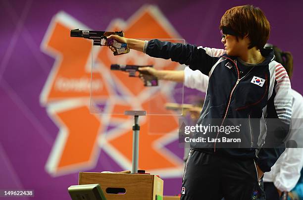 Jangmi Kim of Korea competes in the Women's 25m Pistol Shooting final on Day 5 of the London 2012 Olympic Games at The Royal Artillery Barracks on...