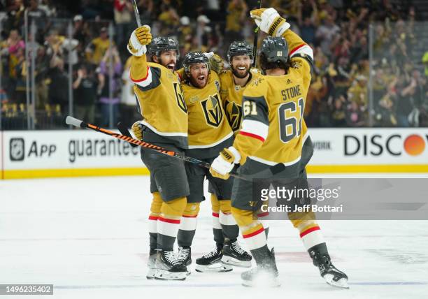 Jonathan Marchessault of the Vegas Golden Knights celebrates with teammates after a goal during the first period against the Florida Panthers in Game...