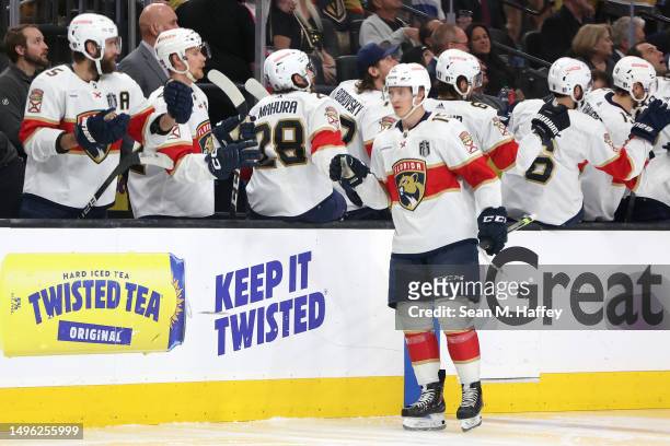 Anton Lundell of the Florida Panthers is congratulated by his teammates after scoring a goal against the Vegas Golden Knights during the third period...