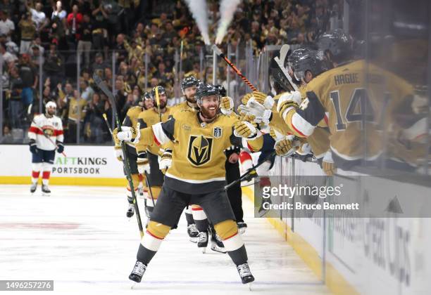 Jonathan Marchessault of the Vegas Golden Knights is congratulated by his teammates after scoring a goal against the Florida Panthers during the...