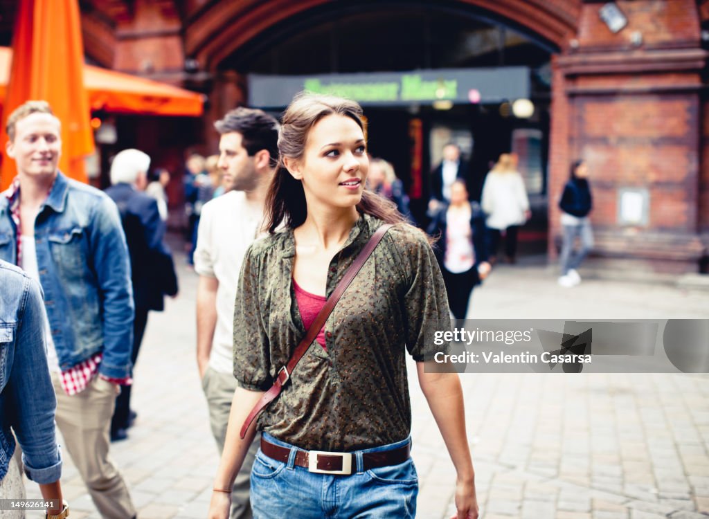 Young adults on city sidewalk