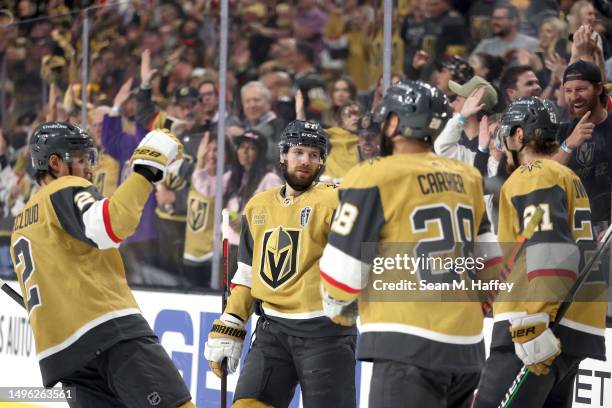 Brett Howden of the Vegas Golden Knights is congratulated by his teammates after scoring a goal against the Florida Panthers during the third period...