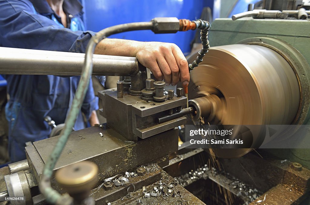 A man checking a milling cutter