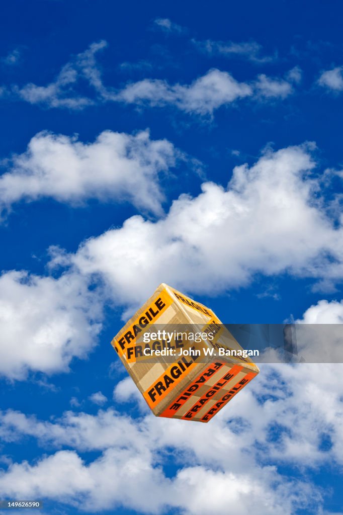 A fragile box falling from the sky