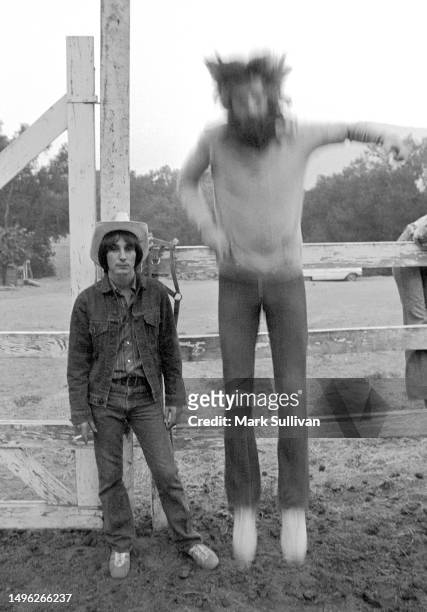 Musicians/Songwriters/Singers Jim Messina and Kenny Loggins of Loggins & Messina musical duo pose on Jim Messina's ranch in Ojai, CA 1974.
