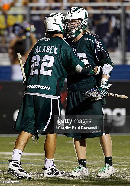 Tom Palasek and Matt Gibson of the Long Island Lizards celebrate a goal by Palasek on the assist by Gibson during the fourth quarter of a Lacrosse...