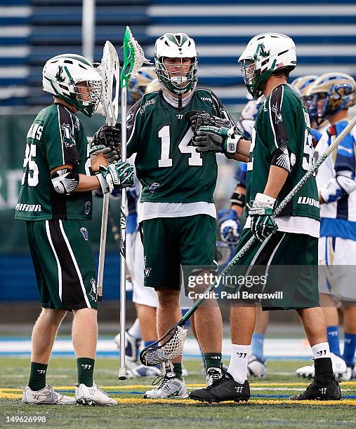 Goalie Drew Adams of the Long Island Lizards talks to teammates during a break in action against the Charlotte Hounds in the second quarter of a...