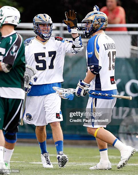 Eric Lusby and Kevin Kaminski of the Charlotte Hounds celebrate a goal in the first quarter of a Lacrosse game vs the Long Island Lizards at James M....