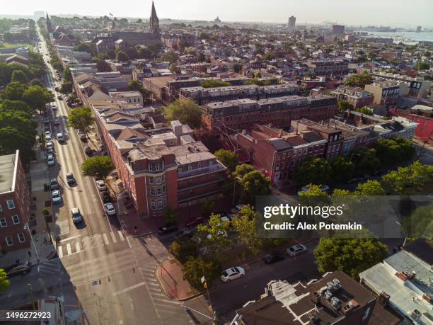 house rental and residential district in baltimore. neighborhood of jonestown in sunny day. drone view over washington hills toward inner harbor, md - jonestown guyana stock pictures, royalty-free photos & images