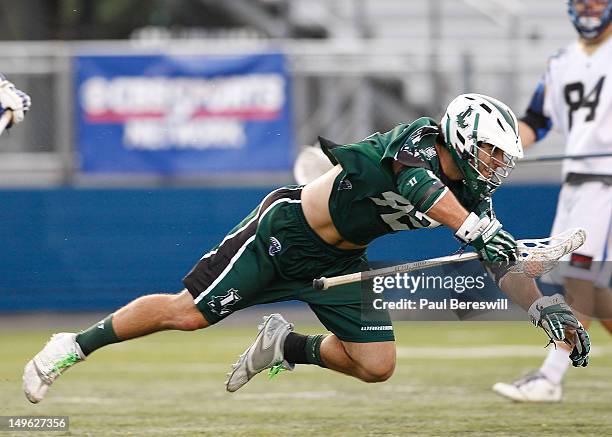 Max Seibald of the Long Island Lizards gets tripped up as he moves the ball during the second quarter of a Lacrosse game against the Charlotte Hounds...