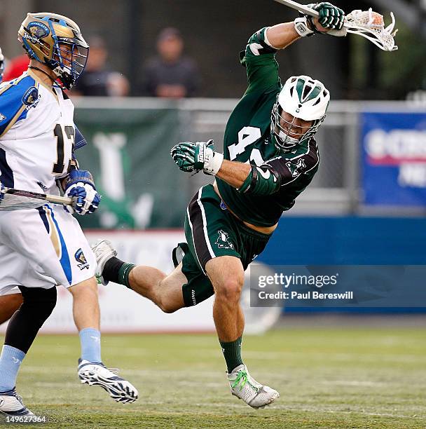 Max Seibald of the Long Island Lizards gets tripped up as he moves the ball during the second quarter of a Lacrosse game against the Charlotte Hounds...