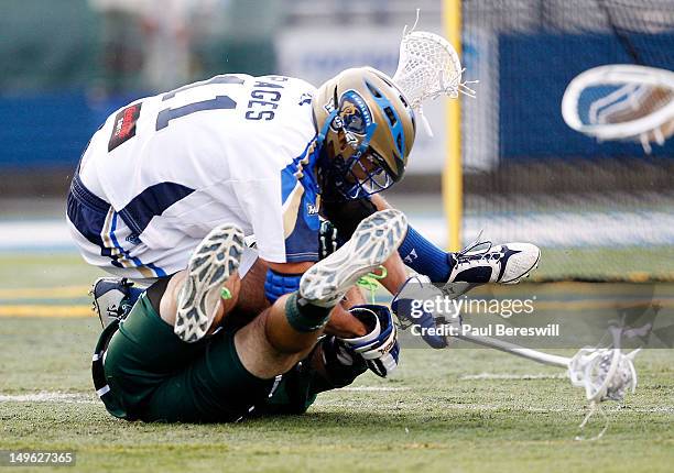Ricky Pages of the Charlotte Hounds tumbles over a defender in the second quarter of a Lacrosse game vs the Long Island Lizards at James M. Shuart...