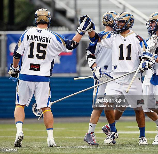Kevin Kaminski of the Charlotte Hounds celebrates a goal with teammate Ricky Pages in the second quarter of a Lacrosse game vs the Long Island...