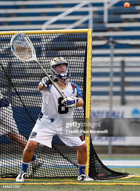 Goalie Adam Ghitelman of the Charlotte Hounds makes a save against the Long Island Lizards in a Lacrosse game at James M. Shuart Stadium on July 28,...