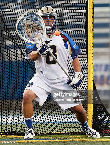 Goalie Adam Ghitelman of the Charlotte Hounds makes a save against the Long Island Lizards in a Lacrosse game at James M. Shuart Stadium on July 28,...