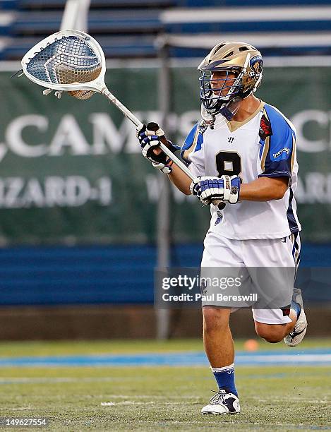 Goalie Adam Ghitelman of the Charlotte Hounds clears the ball against the Long Island Lizards in a Lacrosse game at James M. Shuart Stadium on July...