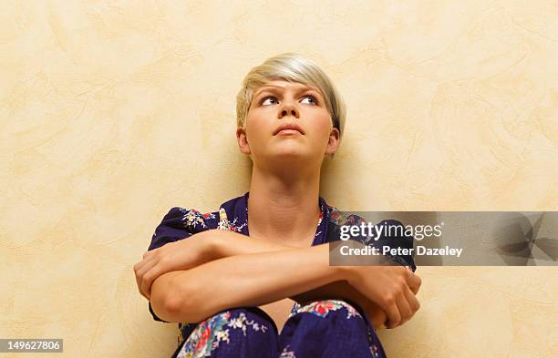 troubled woman in contemplation - nederlaag stockfoto's en -beelden