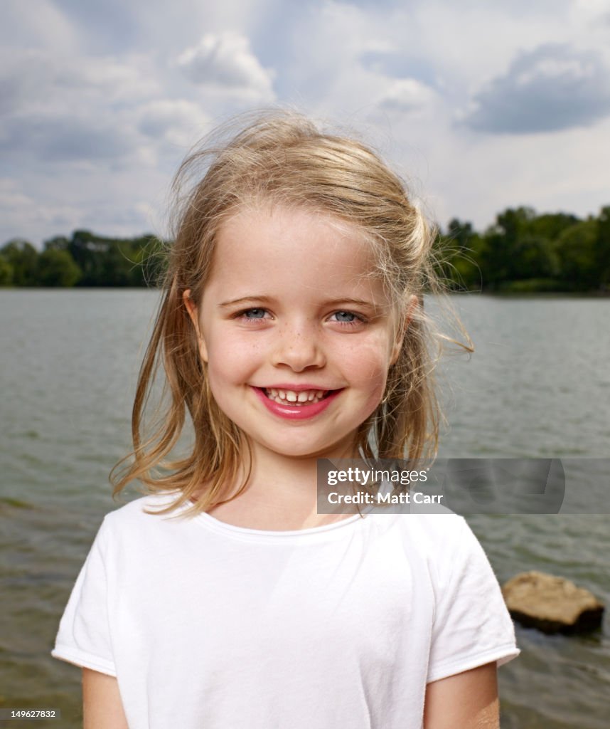 Young girl by lake