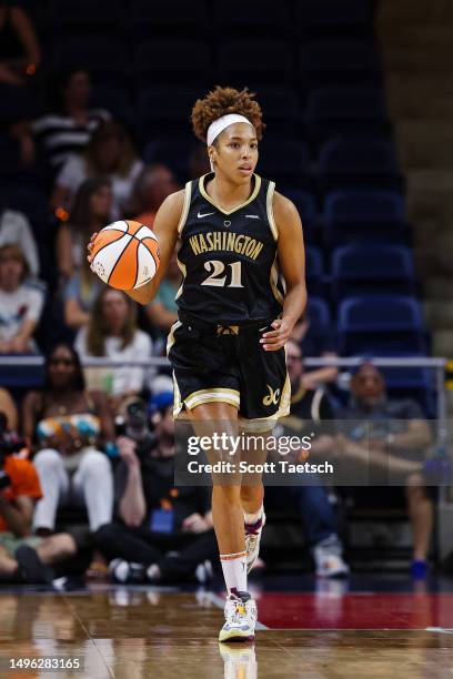 Tianna Hawkins of the Washington Mystics brings the ball up court against the Dallas Wings during the first half of the game at Entertainment &...