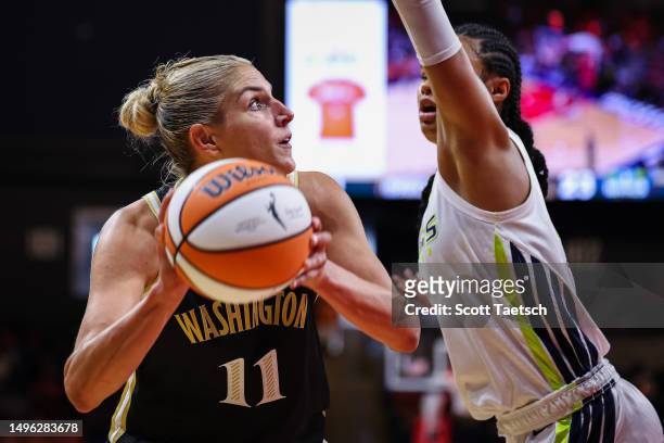Elena Delle Donne of the Washington Mystics goes to the basket against Satou Sabally of the Dallas Wings during the first half of the game at...
