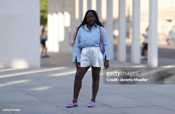 Lois Opoku wearing Hermes lilac velvet leather loafer, Chanel lilac matching leather bag, Zara beige silk mini beige shorts and Munthe blur flannel...