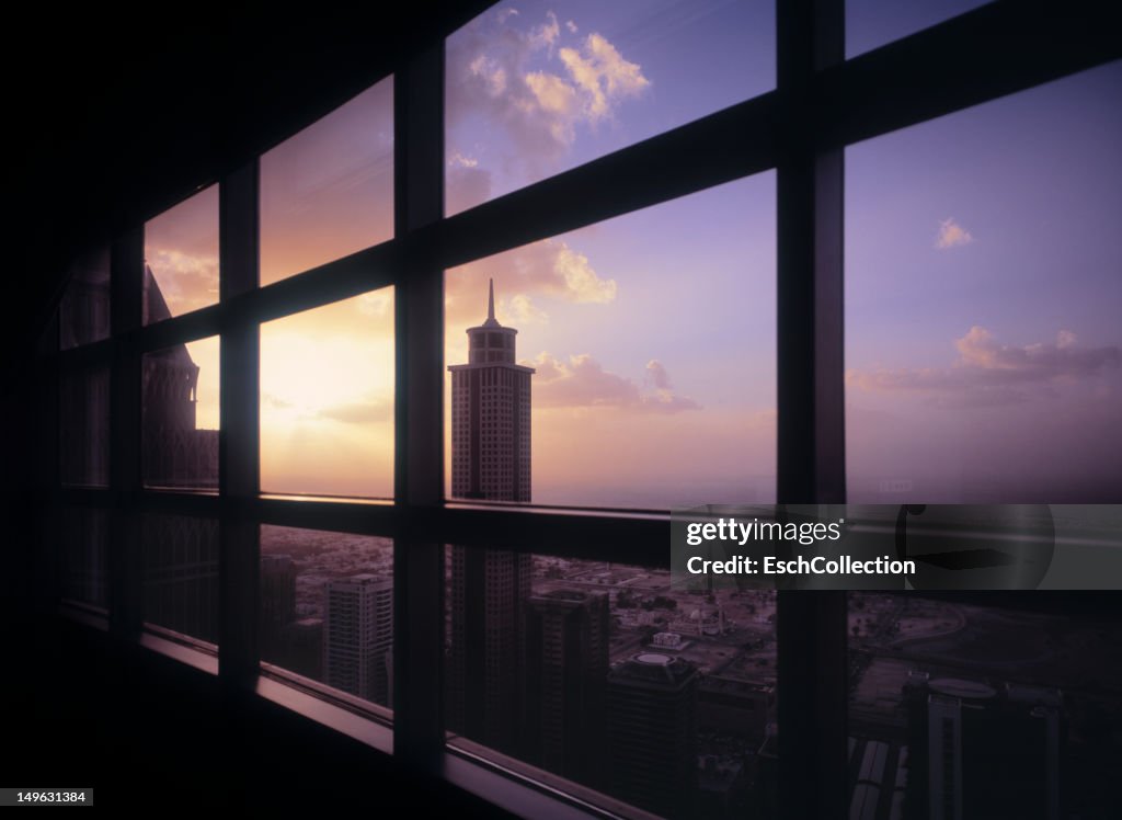 Window view of Dubai at sunset, UAE.