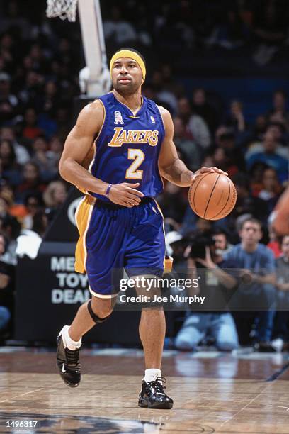 Point guard Derek Fisher of the Los Angeles Lakers dribbles the ball during the NBA game against the Memphis Grizzlies at the Pyramid Arena in...