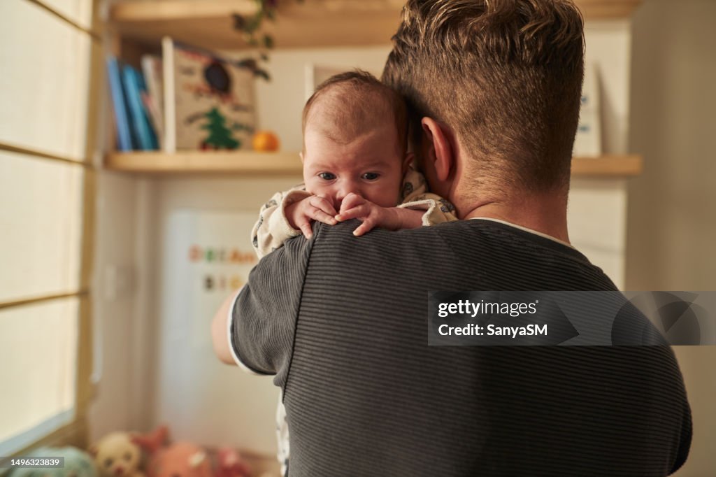 Father is taking care of newborn baby