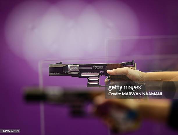 Shooters compete in the in the 25m Pistol Women Precision and Rapid final at the London 2012 Olympic Games at the Royal Artillery Barracks in London,...