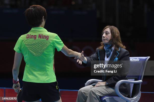 Ning Ding of China shakes hands with umpire after the Women's Singles Table Tennis Gold Medal match against Xiaoxia Li of China on Day 5 of the...