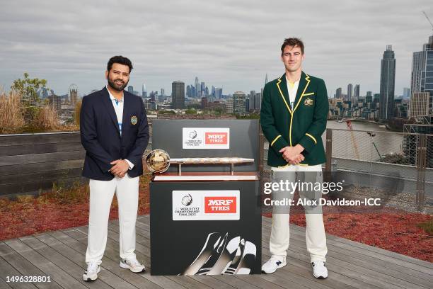 Rohit Sharma, captain of India poses with Pat Cummins, captain of Australia and the ICC World Test Championship mace prior to the ICC World Test...