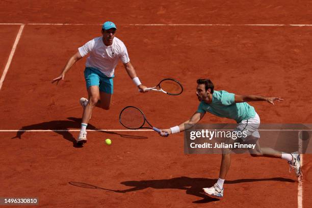 Marcel Granollers of Spain plays a forehand alongside partner Horacio Zeballos of Argentina against Neal Skupski of Great Britain and Wesley Koolhof...