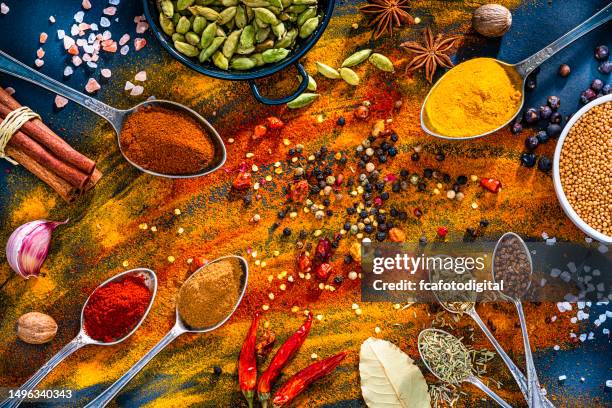 abstract background of colorful spices. - spice powder stock pictures, royalty-free photos & images