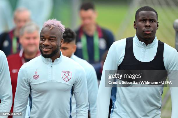 Maxwel Cornet and Kurt Zouma of West Ham United look on during a West Ham United Training Session prior to the UEFA Europa Conference League 2022/23...