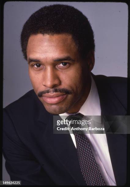 Portrait of American baseball player Dave Winfield, of the New York Yankees, dressed in a suit and tie as he poses against a gray background, New...
