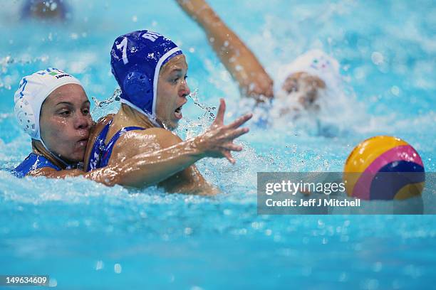 Tania di Mario of Italy tackles Ekterina Lisunova of Russia on Day 5 of the London 2012 Olympics at Water Polo Arena on August 1, 2012 in London,...