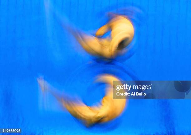 Alexandre Despatie and Reuben Ross of Canada react as they compete in the Men's Synchronised 3m Springboard Diving on Day 5 of the London 2012...